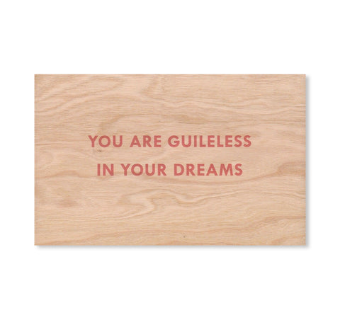 YOU ARE GUILELESS IN YOUR DREAMS WOODEN POSTCARD by Jenny Holzer [RED TEXT]