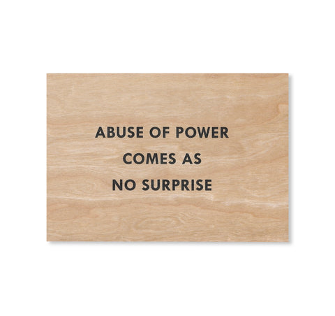 ABUSE OF POWER COMES AS NO SURPRISE WOODEN POSTCARD by Jenny Holzer [BLACK TEXT]